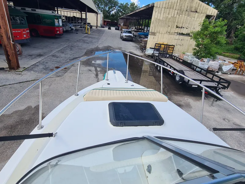 Slide: The Image of Bow view of 2000 Key West 2300 WA Bluewater boat in a storage area. - 7