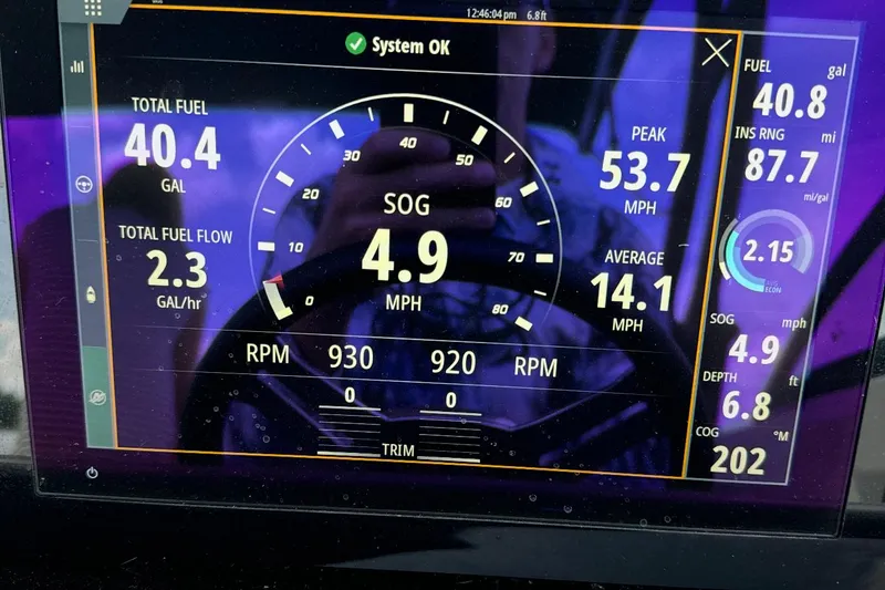 Slide: The Image of Dashboard display of a 2023 Sea Ray SDX 290 Outboard showing fuel and speed metrics. - 10