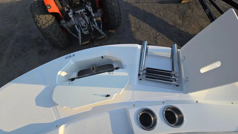 Slide: The Image of 2022 Hurricane SunDeck 191 OB boat deck with ladder and cup holders. - 19