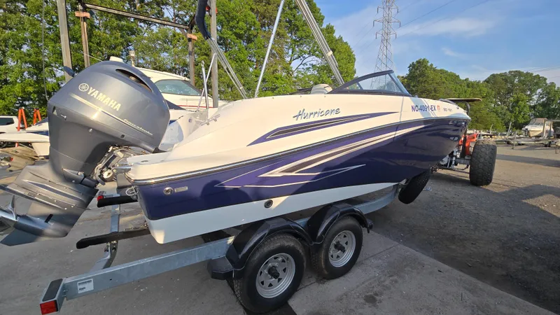 Slide: The Image of 2022 Hurricane SunDeck 191 OB boat on trailer with Yamaha outboard motor. - 2