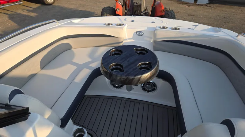 Slide: The Image of 2022 Hurricane SunDeck 191 OB boat interior with seating and table, showcasing luxury design. - 21