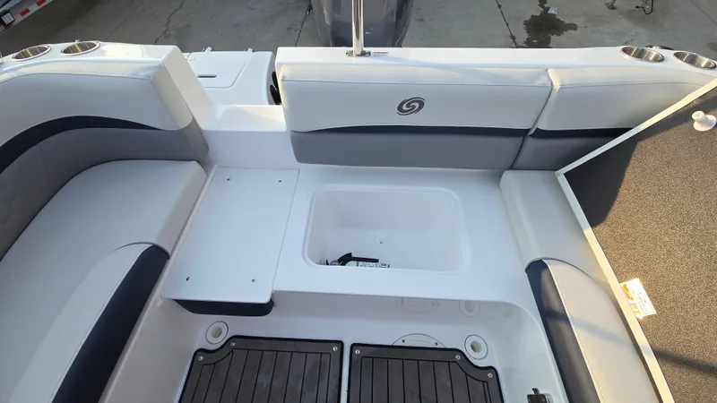 Slide: The Image of 2022 Hurricane SunDeck 191 OB boat interior with seating and storage compartments. - 26