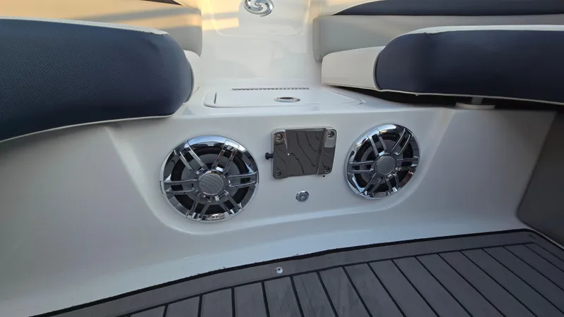 Slide: The Image of 2022 Hurricane SunDeck 191 OB boat interior with speakers and cushioned seating. - 27