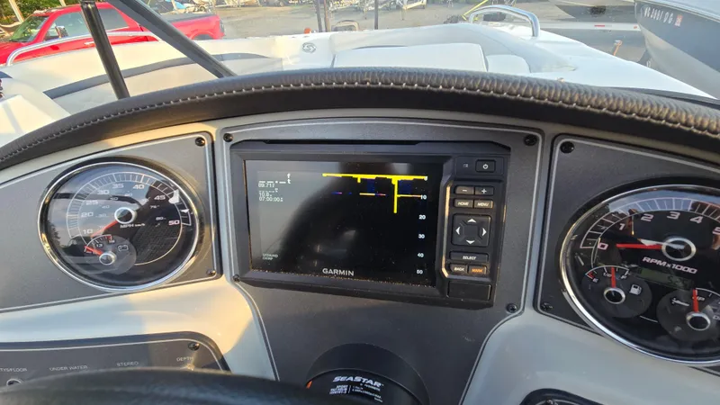 Slide: The Image of Dashboard of 2022 Hurricane SunDeck 191 OB with Garmin display and gauges. - 33