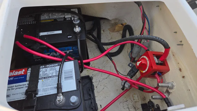 Slide: The Image of Battery compartment of 2022 Hurricane SunDeck 191 OB with wiring and switch. - 39