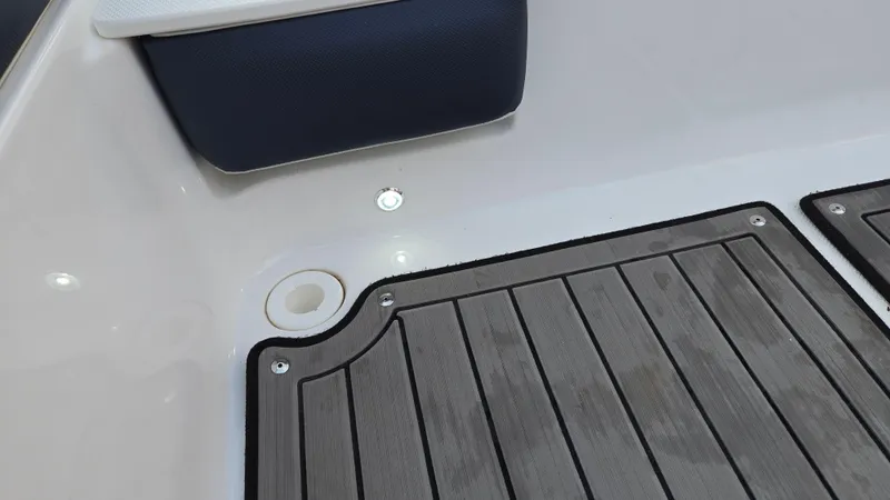 Slide: The Image of 2022 Hurricane SunDeck 191 OB boat interior with cushioned seating and non-slip flooring. - 41