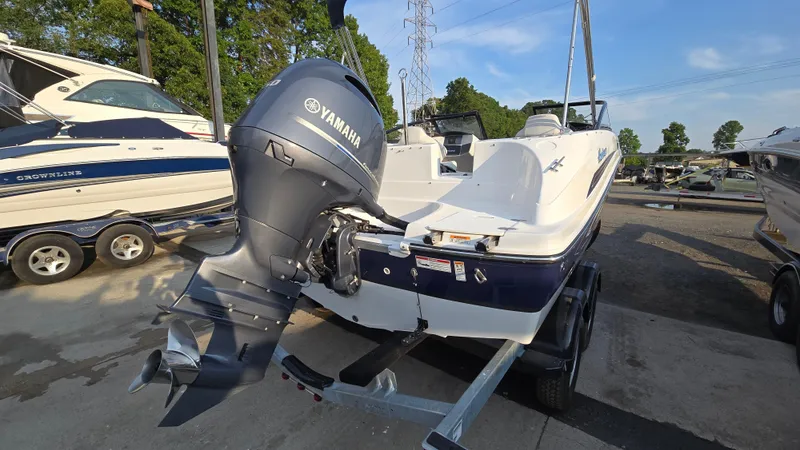 Slide: The Image of 2022 Hurricane SunDeck 191 OB boat with Yamaha outboard motor on trailer. - 5