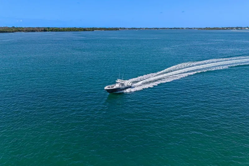 Slide: The Image of 2026 Yellowfin 36 Offshore boat cruising on open blue water. - 10