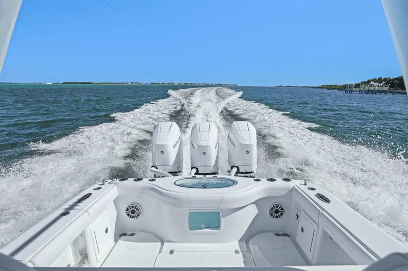 Slide: The Image of 2026 Yellowfin 36 Offshore boat cruising on open water with powerful engines. - 13