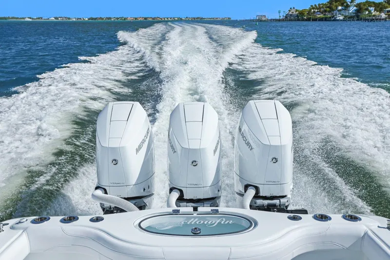 Slide: The Image of 2026 Yellowfin 36 Offshore boat with triple Mercury engines cruising on open water. - 14