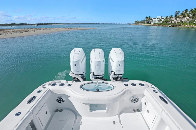 Slide: The Image of 2026 Yellowfin 36 Offshore boat with triple engines on calm water. - 15