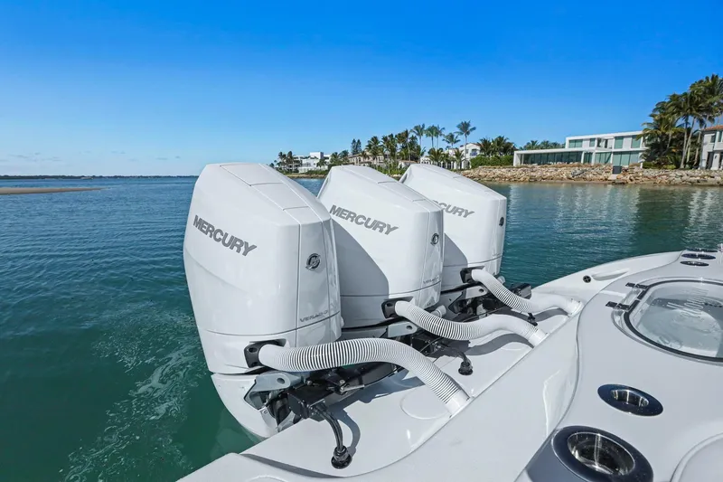 Slide: The Image of 2026 Yellowfin 36 Offshore boat with triple Mercury outboard engines on a sunny day. - 17