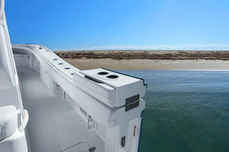 Slide: The Image of 2026 Yellowfin 36 Offshore boat interior with ocean and beach view. - 19
