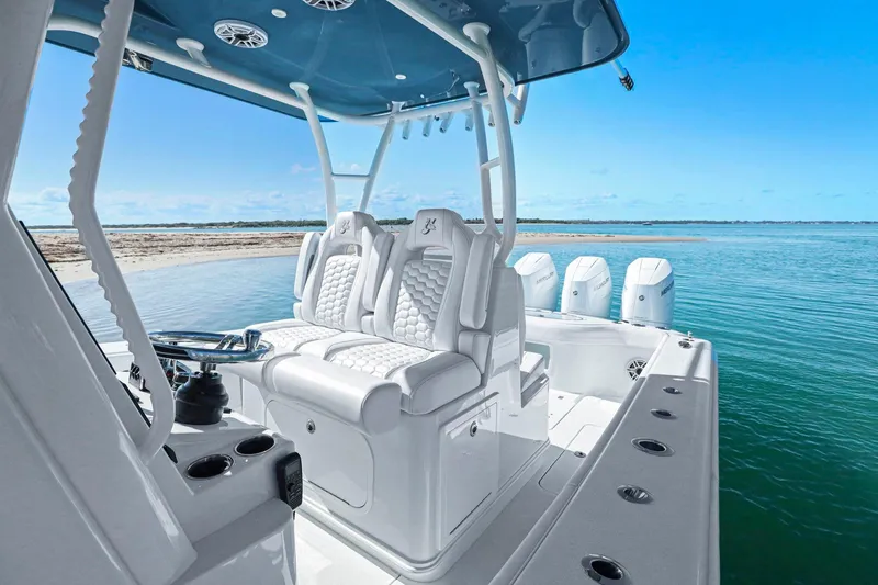 Slide: The Image of 2026 Yellowfin 36 Offshore boat interior with luxurious seating and ocean view. - 22