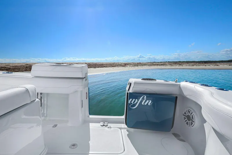 Slide: The Image of 2026 Yellowfin 36 Offshore boat interior with ocean view and clear blue sky. - 38