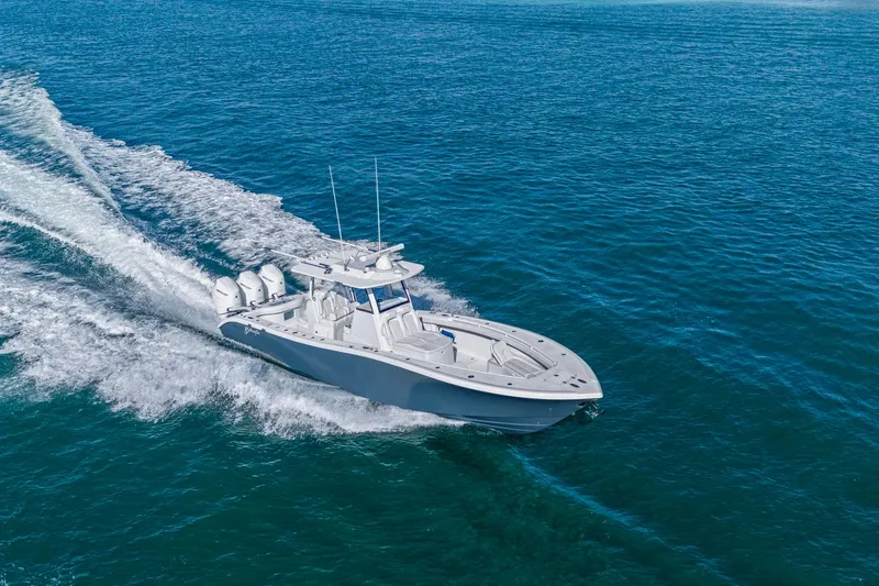 Slide: The Image of 2026 Yellowfin 36 Offshore boat cruising on open blue water. - 4
