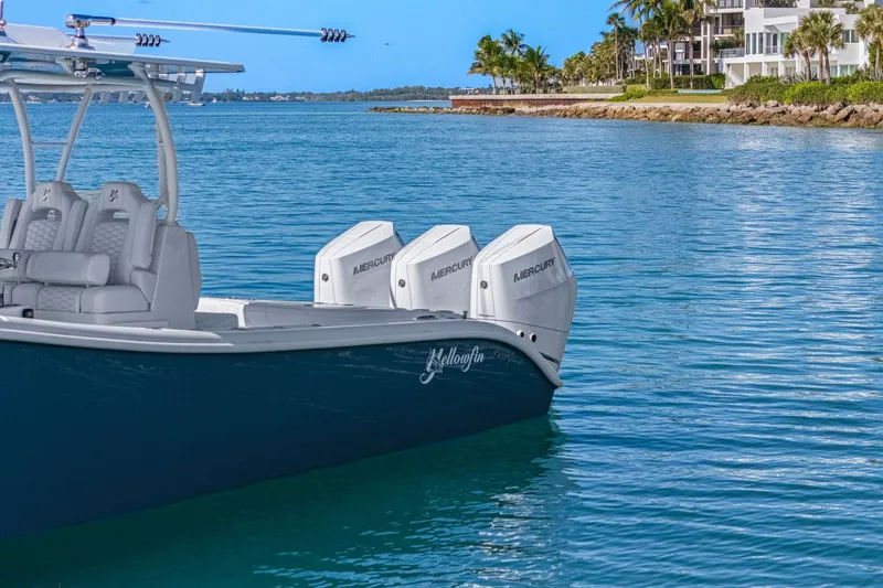 Slide: The Image of 2026 Yellowfin 36 Offshore boat with triple Mercury engines on calm water. - 44