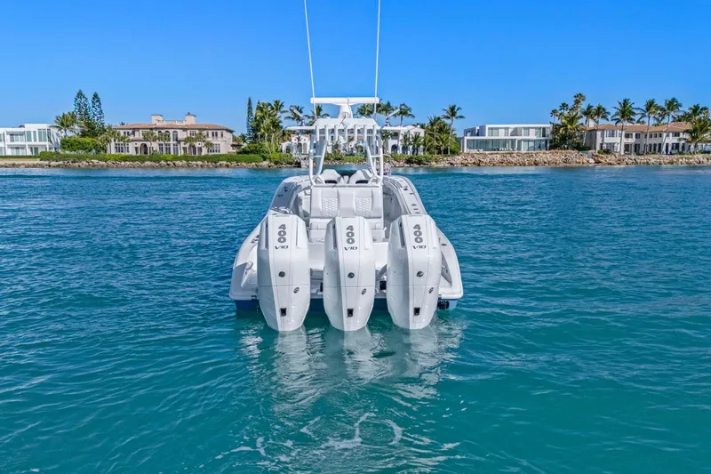 Slide: The Image of 2026 Yellowfin 36 Offshore boat with quad 400 V10 engines on blue water. - 48