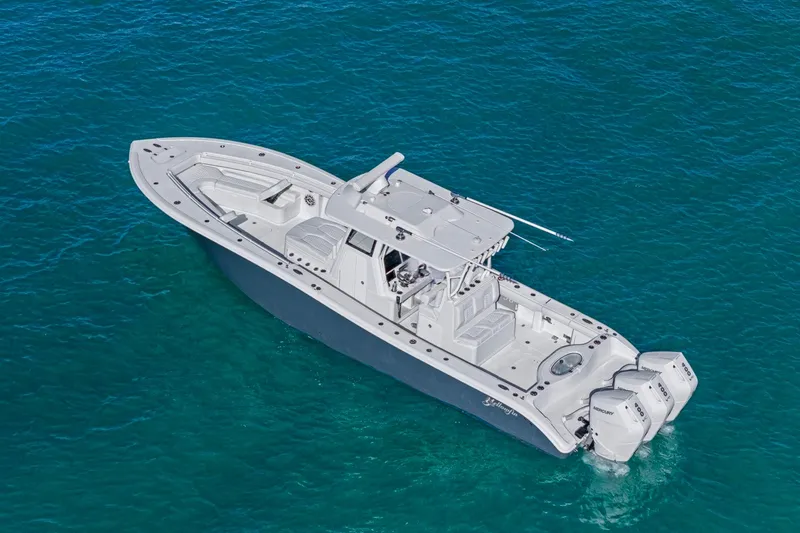 Slide: The Image of 2026 Yellowfin 36 Offshore boat on clear blue water, aerial view. - 50