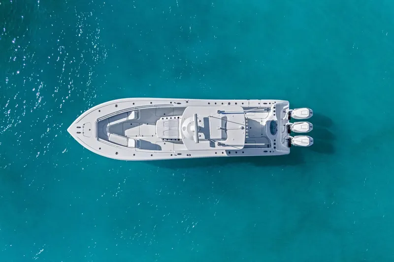 Slide: The Image of Aerial view of 2026 Yellowfin 36 Offshore boat on clear blue water. - 56
