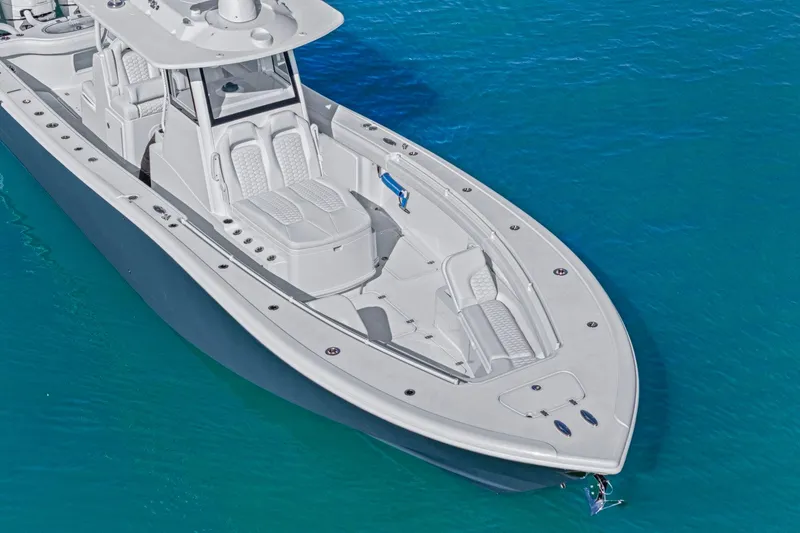 Slide: The Image of 2026 Yellowfin 36 Offshore boat on clear blue water, showcasing sleek design and spacious deck. - 57