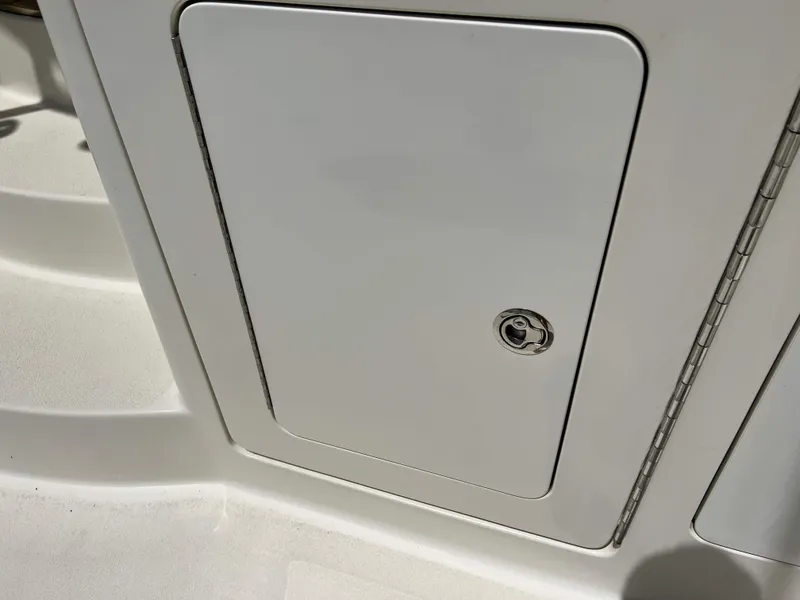 Slide: The Image of Access hatch on 2022 Henriques 42 Express Hardtop boat, featuring a sleek design. - 13