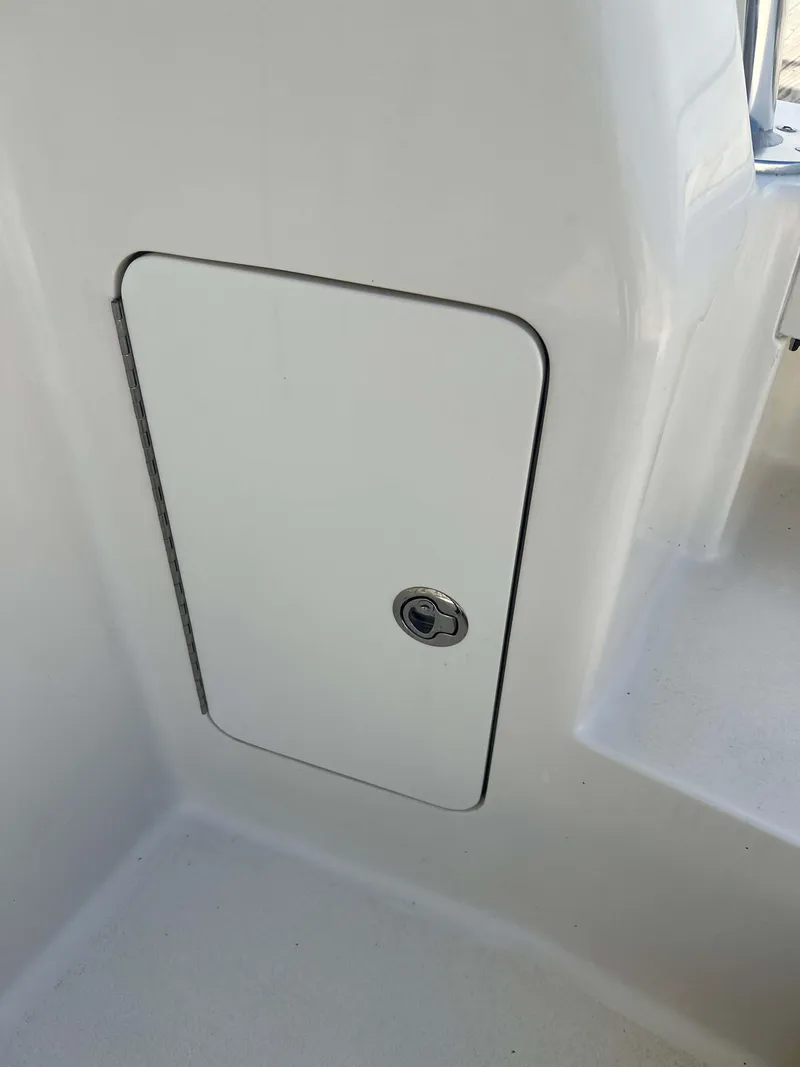 Slide: The Image of 2022 Henriques 42 Express Hardtop, white storage compartment with lock. - 15