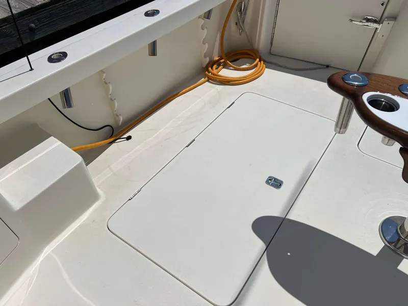 Slide: The Image of Deck of 2022 Henriques 42 Express Hardtop with storage hatch and fishing rod holders. - 17