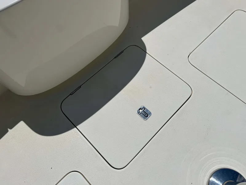 Slide: The Image of Deck hatch on 2022 Henriques 42 Express Hardtop boat, featuring a sleek, modern design. - 26