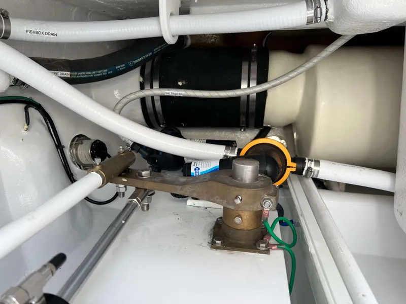 Slide: The Image of Engine compartment of 2022 Henriques 42 Express Hardtop with visible hoses and mechanical components. - 31