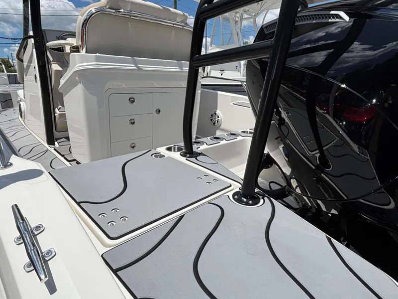 Slide: The Image of 2023 Boston Whaler 220 Dauntless boat interior with seating and storage compartments. - 5