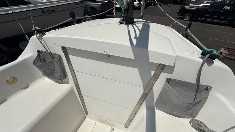 Slide: The Image of Cockpit of 2011 Marlow-Hunter 22 sailboat with storage nets and rigging. - 12