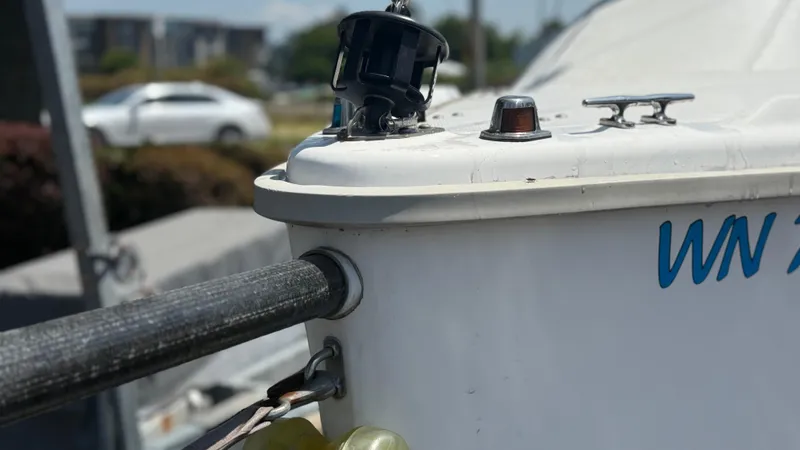 Slide: The Image of Sailboat detail of a 2011 Marlow-Hunter 22, featuring deck fittings and a mooring line. - 4