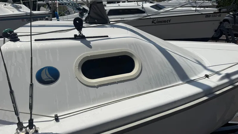 Slide: The Image of Sailboat cabin of a 2011 Marlow-Hunter 22, featuring sleek design and window detail. - 5