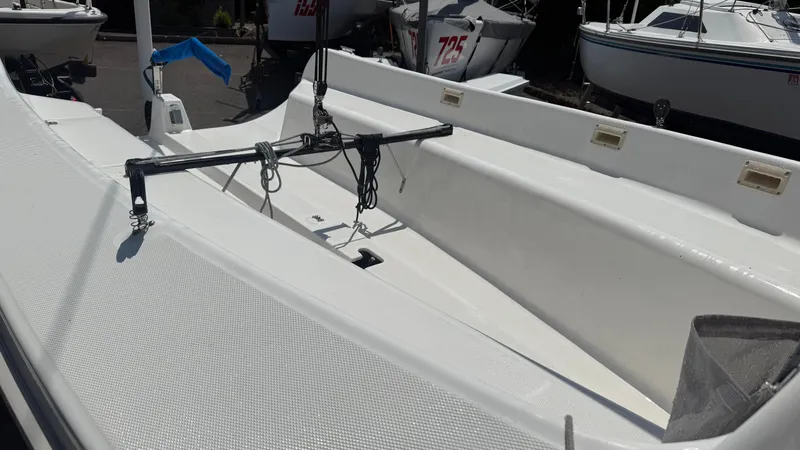 Slide: The Image of 2011 Marlow-Hunter 22 sailboat interior with white deck and rigging. - 7