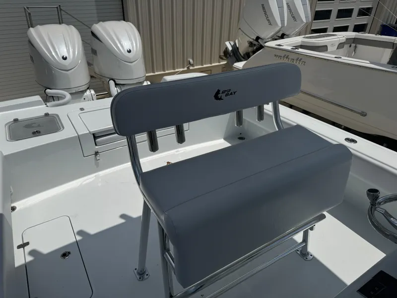 Slide: The Image of 2025 Contender 29 Bay boat interior with dual outboard engines and seating. - 4