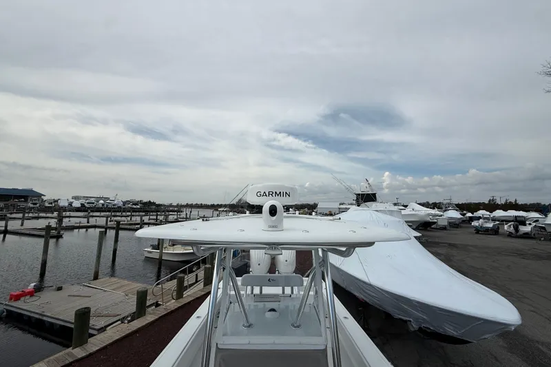 Slide: The Image of 2025 Contender 29 Bay boat at marina with Garmin equipment, overcast sky. - 8