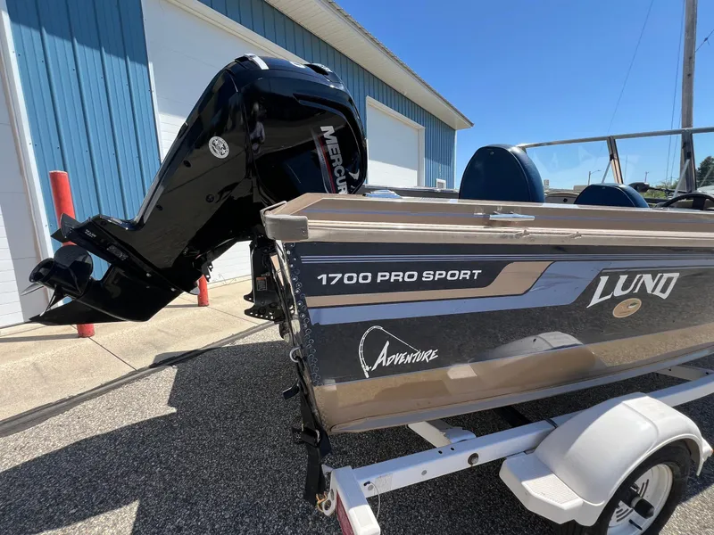 Slide: The Image of 1998 Lund 1700 Pro Sport Adventure boat with Mercury outboard motor on trailer. - 7