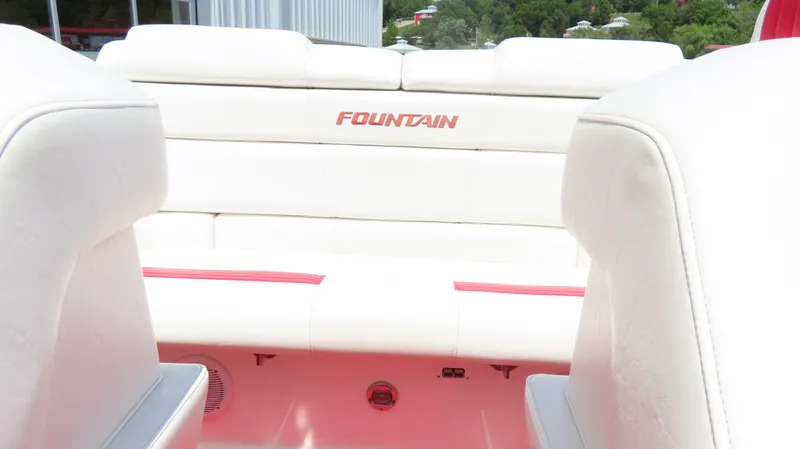 Slide: The Image of Interior of 2004 Fountain 35 Executioner boat with white and red seating. - 14