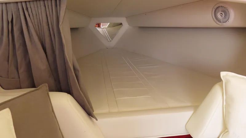 Slide: The Image of Interior cabin of 2004 Fountain 35 Executioner boat, featuring a cozy sleeping area. - 15