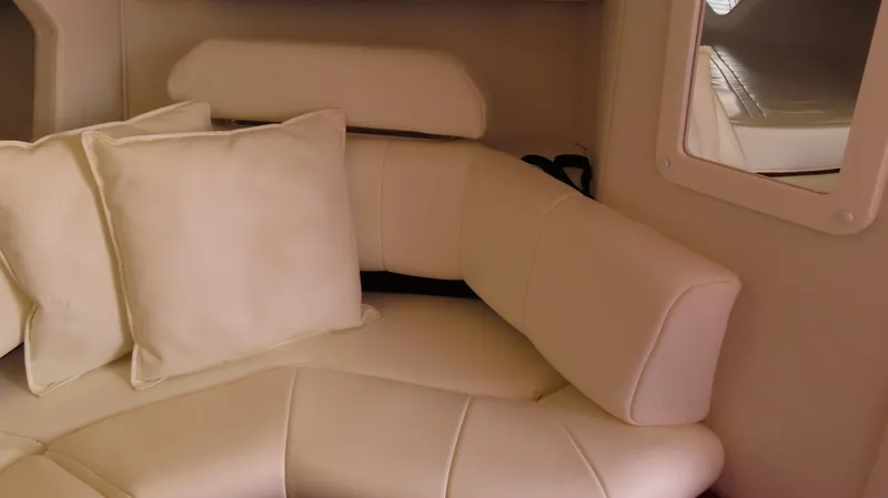 Slide: The Image of Interior of 2004 Fountain 35 Executioner boat with white leather seating and cushions. - 16