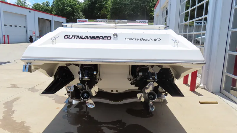 Slide: The Image of 2004 Fountain 35 Executioner boat, rear view, dual propellers, "Outnumbered" text, Sunrise Beach, MO. - 20