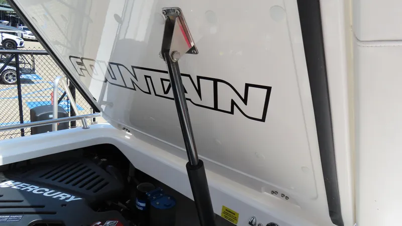 Slide: The Image of 2004 Fountain 35 Executioner boat engine compartment with Mercury engine visible. - 22