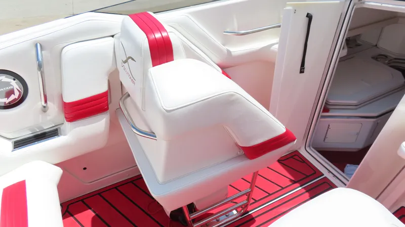 Slide: The Image of 2004 Fountain 35 Executioner boat interior with white and red seating and cabin entrance. - 23