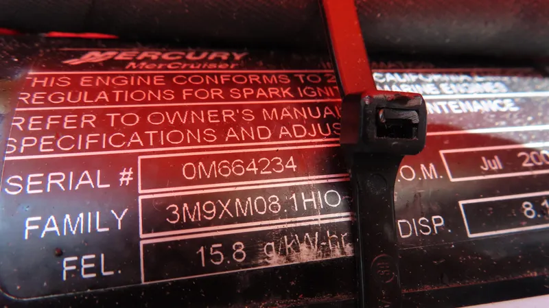 Slide: The Image of Close-up of Mercury MerCruiser engine label with serial number and specifications. - 28