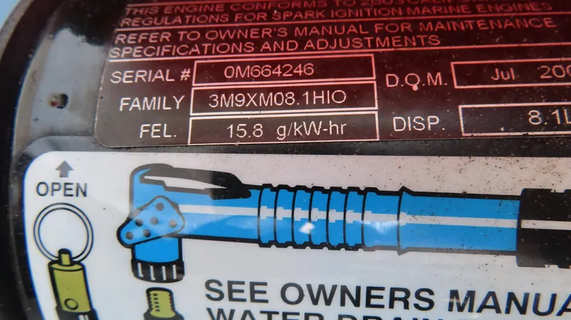 Slide: The Image of Close-up of a 2004 Fountain 35 Executioner engine label with specifications and maintenance instructions. - 29