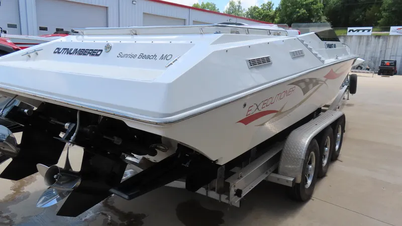 Slide: The Image of 2004 Fountain 35 Executioner boat on trailer, rear view, in outdoor setting. - 5