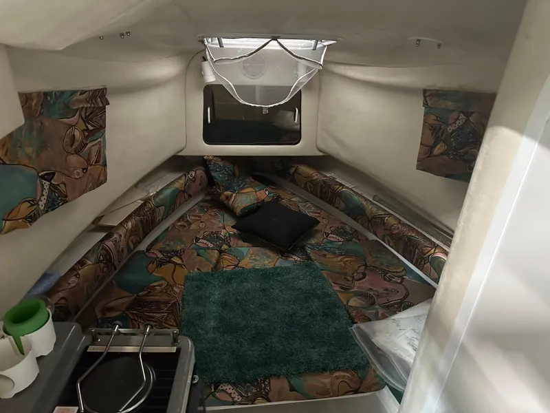Slide: The Image of Interior cabin of 1996 Pro-Line 251 Walkaround I/O boat with patterned cushions. - 16
