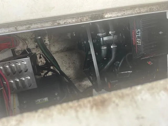 Slide: The Image of Engine compartment of a 1997 Monterey 296 Cruiser, featuring a 5.7L EFI engine. - 21