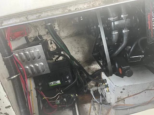 Slide: The Image of Engine compartment of a 1997 Monterey 296 Cruiser boat, showing wiring and mechanical components. - 22